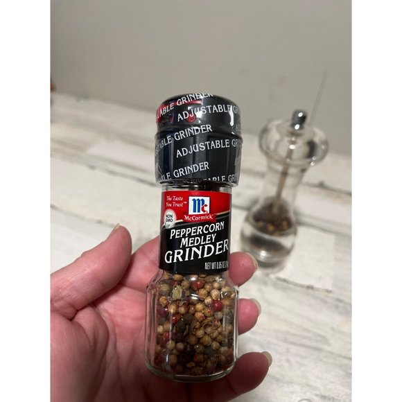 Pepper grinder with unopened jar of McCormick peppercorn medley - Picture 2 of 3